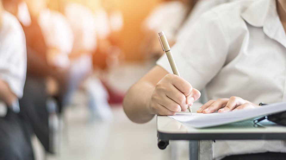 school student writing an exam